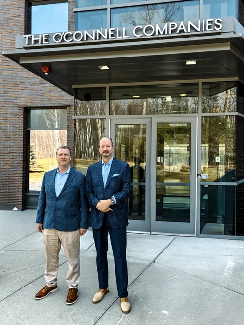 Jim Sullivan and Joe McMahon in front of The O'Connell Companies Headquarters