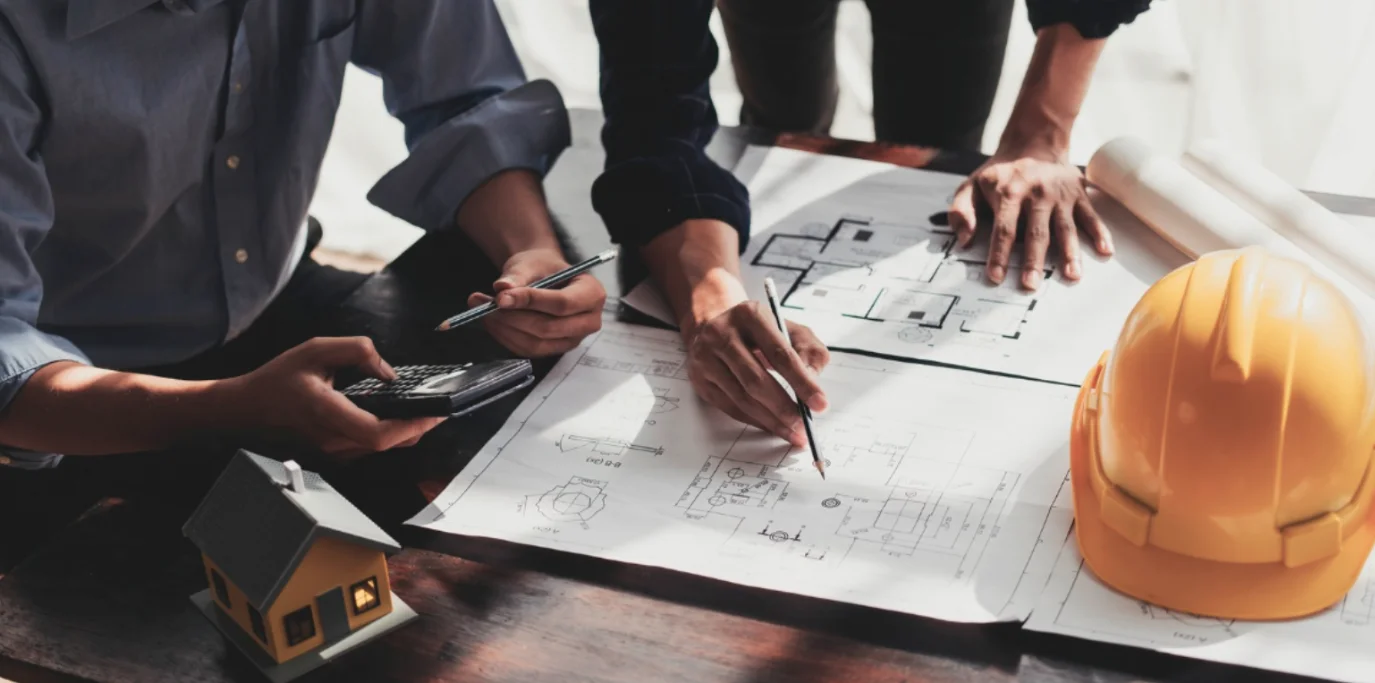 Development consultants reviewing architectural plans and blueprints in Western Massachusetts